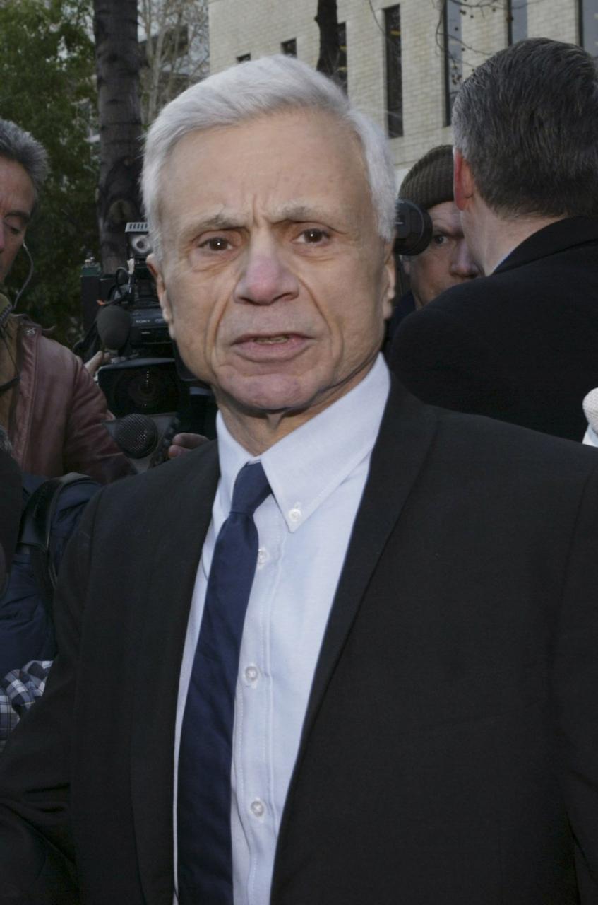 Actor Robert Blake speaks to reporters outside the courthouse as he arrives for a pre-trial hearing in Van Nuys, Calif. December 6, 2004. (Photo by Lee Celano/WireImage)